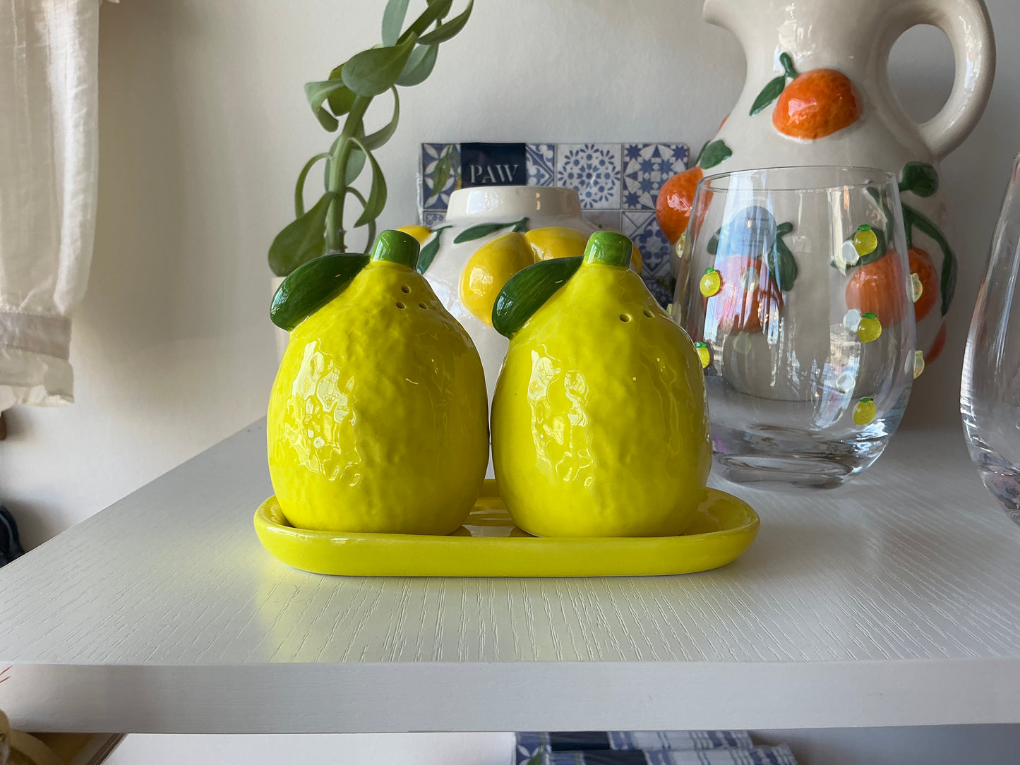 Lemons on tray Salt and pepper shakers